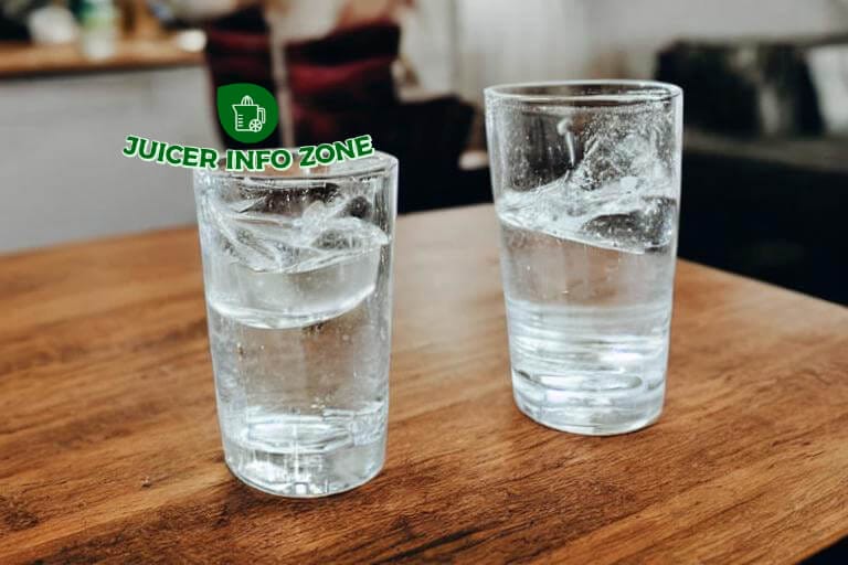 refreshing glass of water sitting on a table